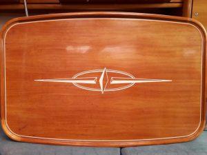 Logo on wooden table on yacht